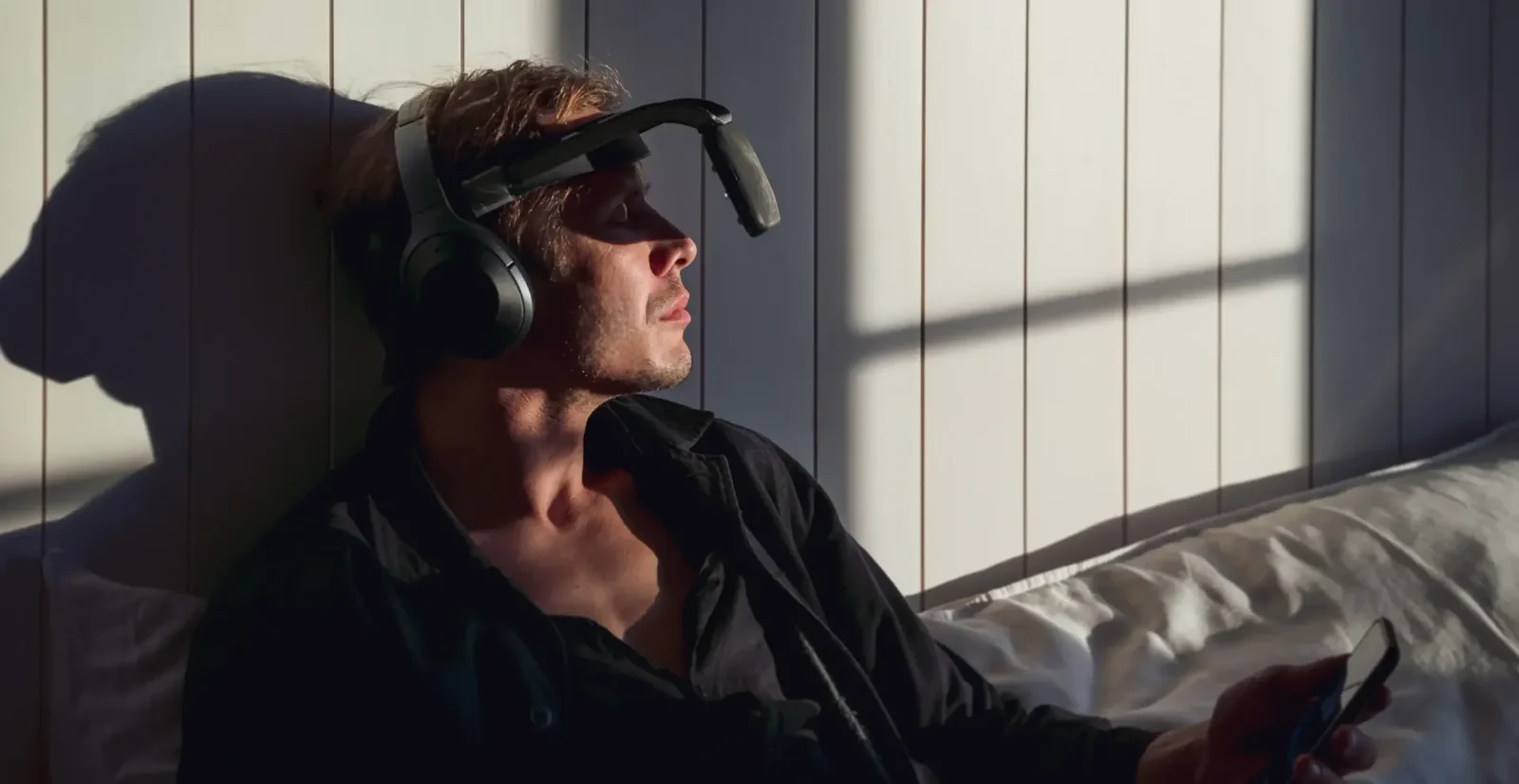 Man using NeuroVizr in bedroom for morning ritual